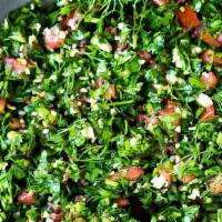 Tabbouleh · Finely chopped parsley, bulgur, tomato, onion and spices mixed in lemon juice &oil.