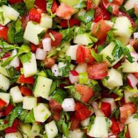 Arabic Salad · Fresh tomatoes and cucumbers with parsley topped with lemon and olive oil.