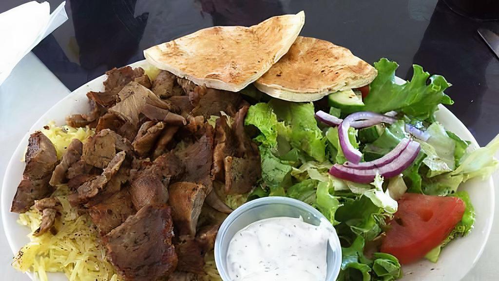 Gyro Plate  · A thinly cut mixture of lamb and beef ground with vegetables and spices. Served with salad, rice, and garlic sauce.
