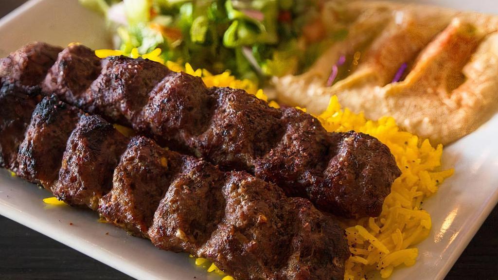 Kufta-Kabob Plate · Grilled mix combination of beef and lamb marinated meat cooked with our special seasoning served with Salad and Rice and Pita Bread and Hummus