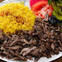 Lamb Shawarma Plate · Thinly sliced marinated boneless Lamb mixed with our special spices - served with salad and ...