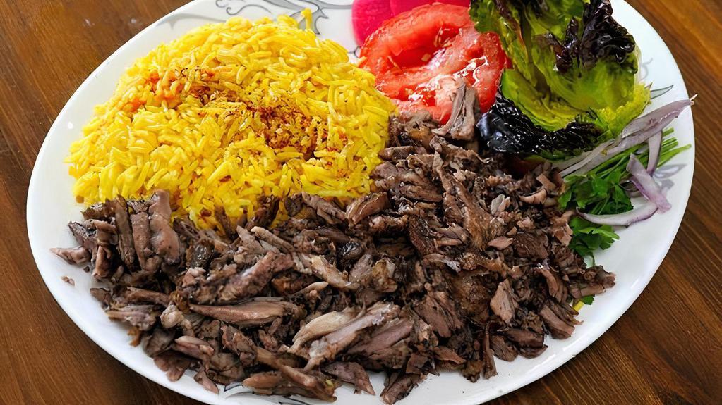 Lamb Shawarma Plate · Thinly sliced marinated boneless Lamb mixed with our special spices - served with salad and rice.