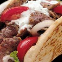 Gyros Sandwich · Thinly cut mixture of lamb and beef mixed with our special spices on a flatbread with lettuc...