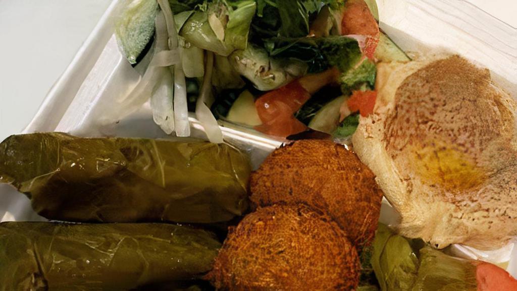 Vegetarian Platter # 1 · Vegan. A combo of hummus, falafel, dolma and Arabic salad served with pita.