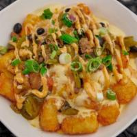 App - South Of Border Tots · Tots with signature loaded queso with tomato, green chilis, onion, black beans, jalapenos, a...