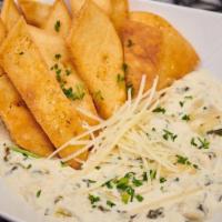 App - Artichoke Cheese Dip · The godfather of dips with a Colorado-twist.  Roasted green chilis and artichokes in a cream...