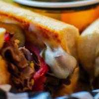 Mister Ed · Roast beef grilled with onion, mushrooms and cherry peppers, topped with melted provolone; d...