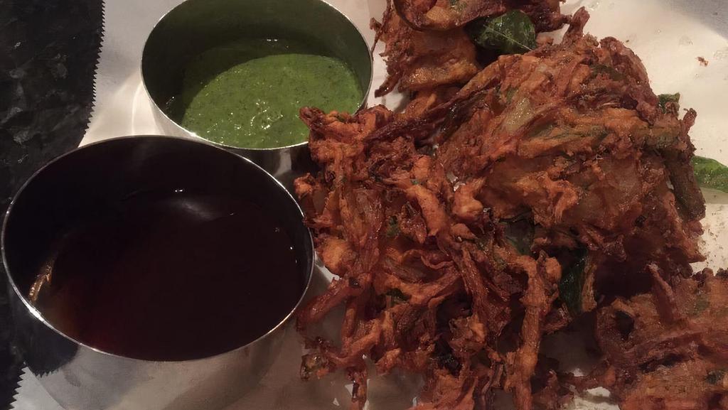 Veg Pakora · Variety of vegetables dipped in chickpeas flour, deep fried served with hot and sweet chutney.