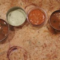 Onion Rava Masala Dosai · Thin and crispy crepe made from cream of wheat and rice, onion and green chili with spicy po...