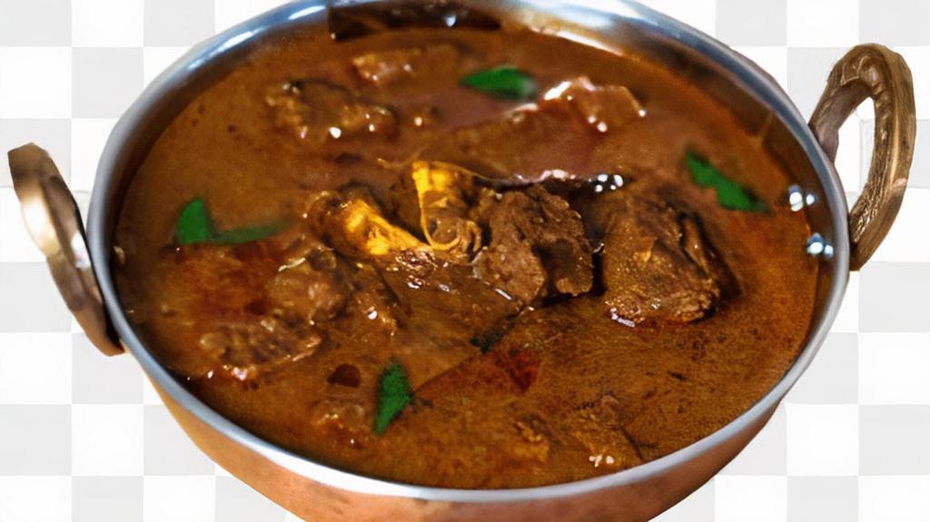 Hyderabad Goat Masala · Spicy goat chunk cooked with red chilli musturd seeds curry