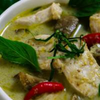 Green Curry · Green curry with coconut milk, bamboo shoots, bell pepper, zucchini, and Thai basil leaves.
