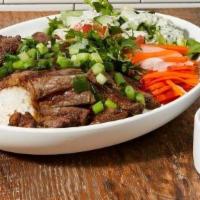 Grilled Short Ribs Bowl (Contains Gluten) · Grilled marinated boneless short ribs served with lettuce, pickled daikon carrot, satay scal...