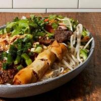 The Cracken Vermicelli ( Contains Gluten ) · Grilled marinated boneless short ribs +Shrimp skewer and an eggroll served with mint, lettuc...