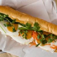 The Eggcited Banh Mi · 3 fried eggs stuffed with pickled daikon carrot, scallions, cucumber, jalapeños, cilantro an...