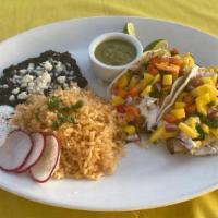 Meat Taco Combo · Two homemade corn tortilla tacos filled with your choice of meat. Served with rice and beans...