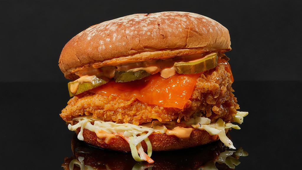 Hot Mama Sandwich · Fried chicken with velveeta cheese, coleslaw, pickles, spicy agave, and our special chick sauce on a potato bun.
