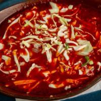 Pozole Soup · Guajillo Broth, Seasoned Pulled Pork, Hominy, Cabbage, Onions, Cilantro