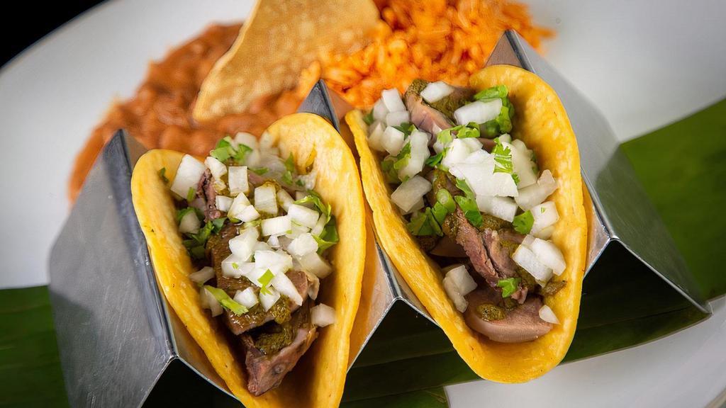 3 Lengua Tacos · Beef Tongue, Corn Tortillas, Onions, Cilantro, Chimichurri, Rice, Refried Beans