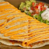 Stacked Quesadillas · Flour Tortilla, Mexican Cheese Blend, Crispy Tortilla Shell, Chipotle Aioli, Lettuce, Sour C...