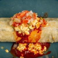 Vegan Breakfast Burrito · Flour Tortilla, Potatoes, Vegan Chorizo, Vegan Cheese, Refried Beans, Traditional Red Sauce ...