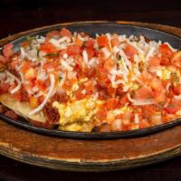 Vegan Huevos Rancheros · Vegan Scrambled Eggs, Two Tostadas, Refried Beans, Ranchero Sauce, Vegan Cheese,  Vegan Pota...