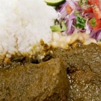 Frejoles Con Seco · Tender pieces of beef slowly cooked with red onions, fresh cilantro, and chicha de jora, ser...