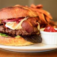 Aion Burger · Colorado beef on a brioche bun with brie, bacon, pickled veggies, greens & crispy fries.