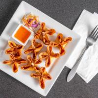 Crab Delight · Fried wonton wrap stuffed with crab meat and cream cheese. Served with sweet and sour sauce.