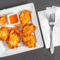 Coconut Prawns · Deep fried coconut breaded prawns. Served with sweet and sour sauce.