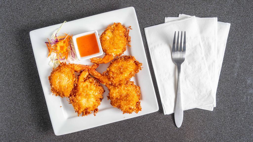 Coconut Prawns · Deep fried coconut breaded prawns. Served with sweet and sour sauce.