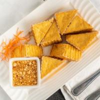 Fried Tofu · Deep fried fresh tofu to crispy brown. Served with sweet and sour sauce and ground peanuts.