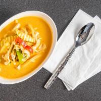 Red Curry · Spicy. Red curry paste in coconut milk with bamboo shoots, zucchini, bell pepper and basil.