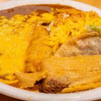 Beef Tamale, Cheese Enchilada, Beef Taco, Rice, & Beans · 