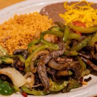 Beef Fajitas · Served with guacamole and sour cream.