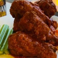 Buffalo Wings · Battered fried and crusted wings tossed in our inflamed buffalo sauce served with celery, ca...