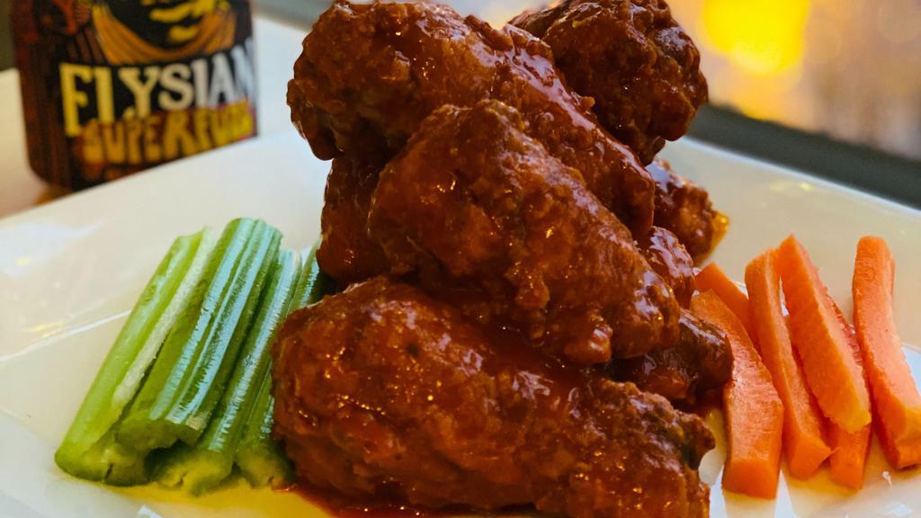 Buffalo Wings · Battered fried and crusted wings tossed in our inflamed buffalo sauce served with celery, carrots, ranch and Blue cheese dressing.