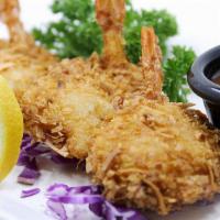 Coconut Prawns · Coconut prawns battered in coconut shavings served with a side of citrus honey coleslaw and ...