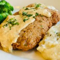 Country Fried Steak · Country fried steak drizzled in our Baja gravy served with seasonal vegetables and mashed po...