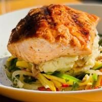 Cajun Salmon · Salmon grilled to your desired taste, accompanied by mashed potatoes, julienne veggies and d...
