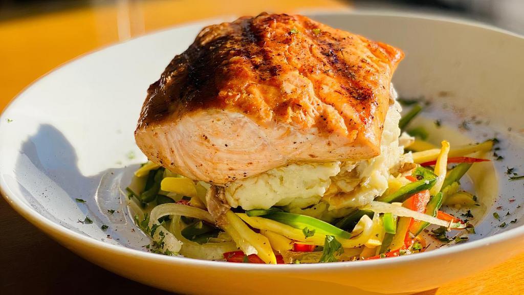 Cajun Salmon · Salmon grilled to your desired taste, accompanied by mashed potatoes, julienne veggies and drizzled with our New Orleans style cajun butter.