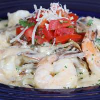 Classic Shirmp Pasta · Grilled shrimp and garlic butter sautéed mushrooms with linguini pasta tossed in a jalapeño ...