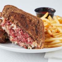 The Reuben · Classic sandwich of corned beef, bistro sauce, sauerkraut and Swiss cheese piled on rye brea...