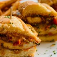 Parmesan Chicken Sandwich · Parmesan panko chicken smothered in Mozzarella cheese and drizzled with red pepper cream sau...