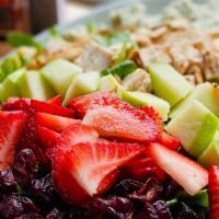 Strawberry Arugula Salad · Arugula filled with grilled chicken breast, fresh strawberries, granny apples, roasted almon...