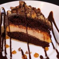 Reese'S Peanut Butter Chocolate Cake · Two moist layers of chocolate cake with dense, crunchy peanut butter filling