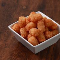 Tater Tot · A fan favorite, these classic tater tots are served gold-brown and crispy.