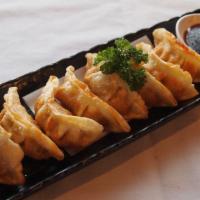 Gyoza · Deep fried potstickers filled w/ pork & vegetables, & gyoza dipping sauce (8pc).