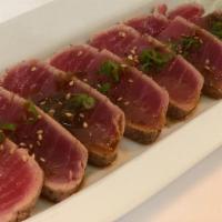 Tuna Tataki Sashimi · Lightly seared and peppered tuna served on daikon (6pc).