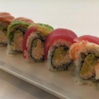 Rainbow Roll · Crabmeat, avocado, cucumber, topped w/ tuna, salmon, snapper, shrimp, & avocado.