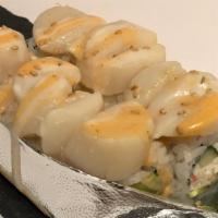 Scallop Roll · Crabmeat, avocado, cucumber, topped w/ scallops - baked, white mayo & spicy mayo sauce.